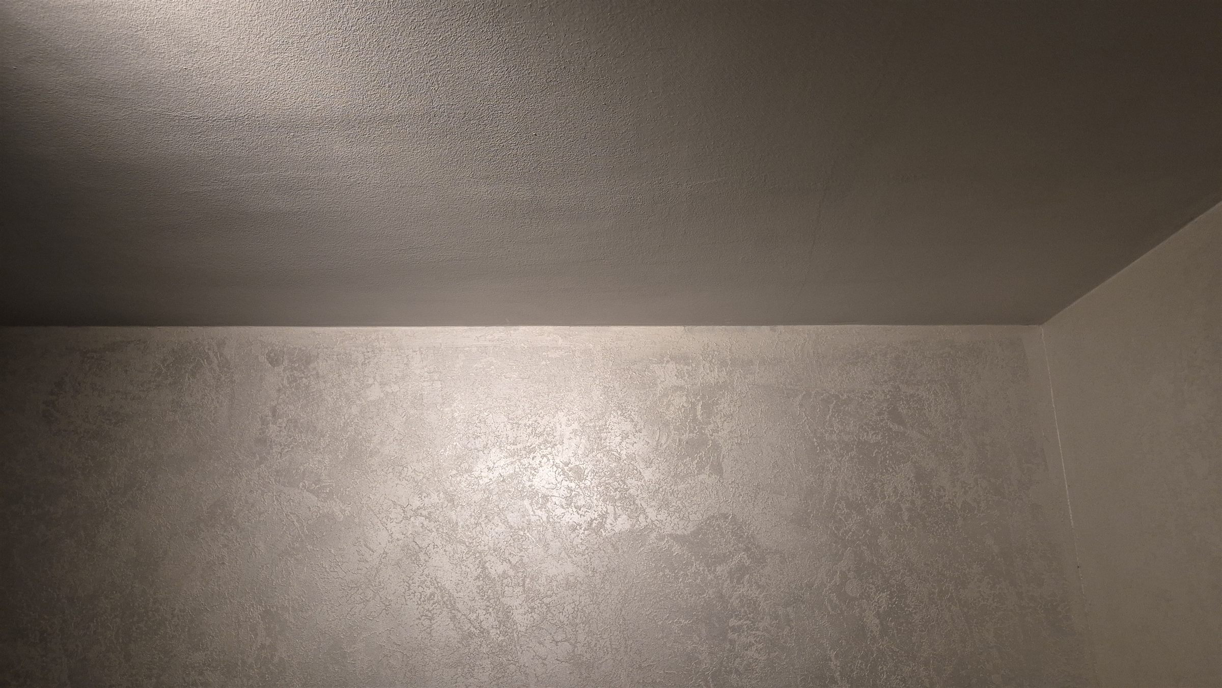 Textured wall detail in low evening light